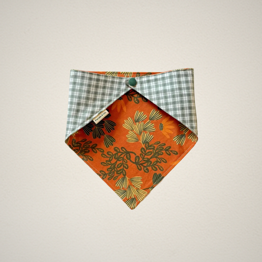 pet bandana with orange floral fabric paired with a green and white plaid fabric