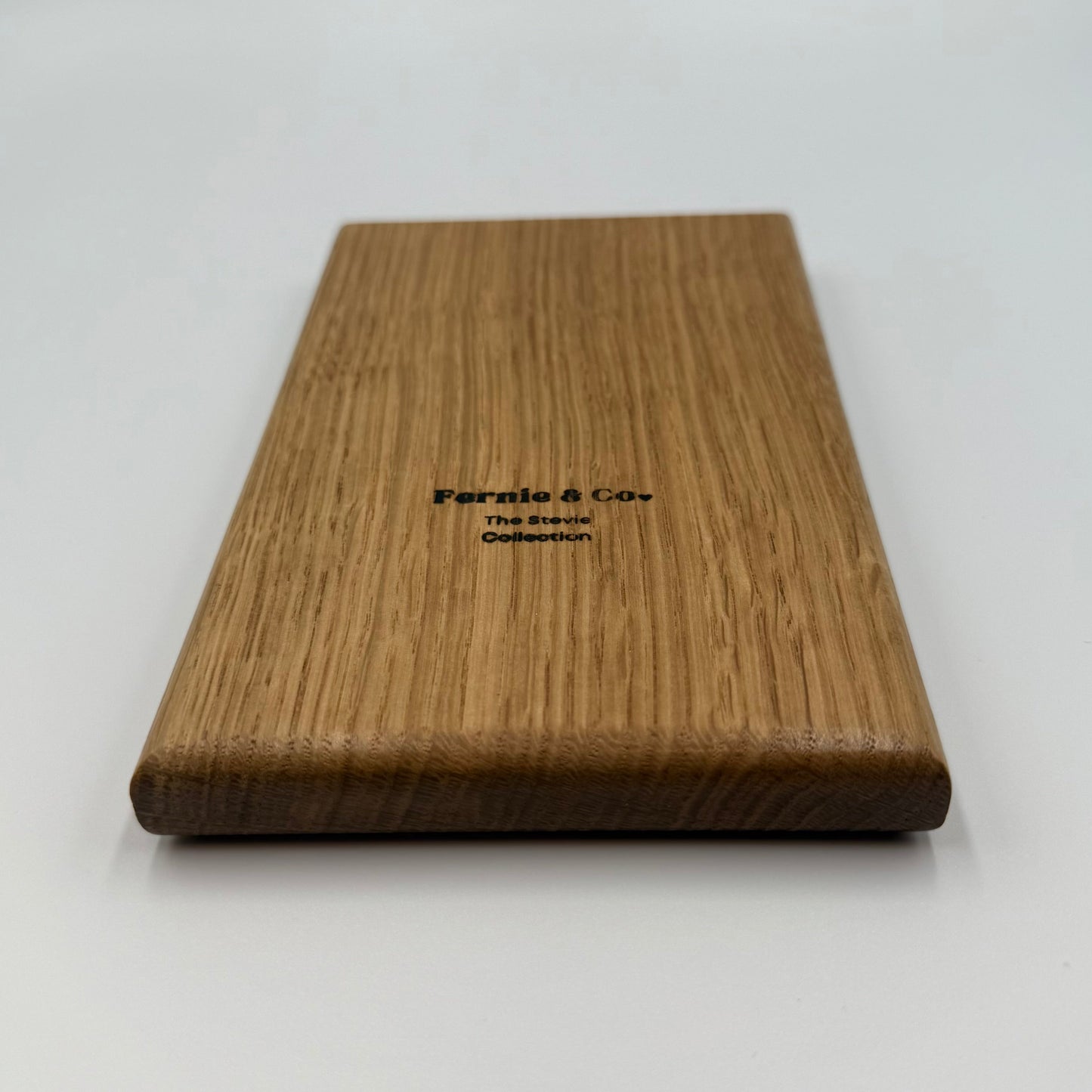 back of white oak tic tac toe board game with Fernie and Co. logo.