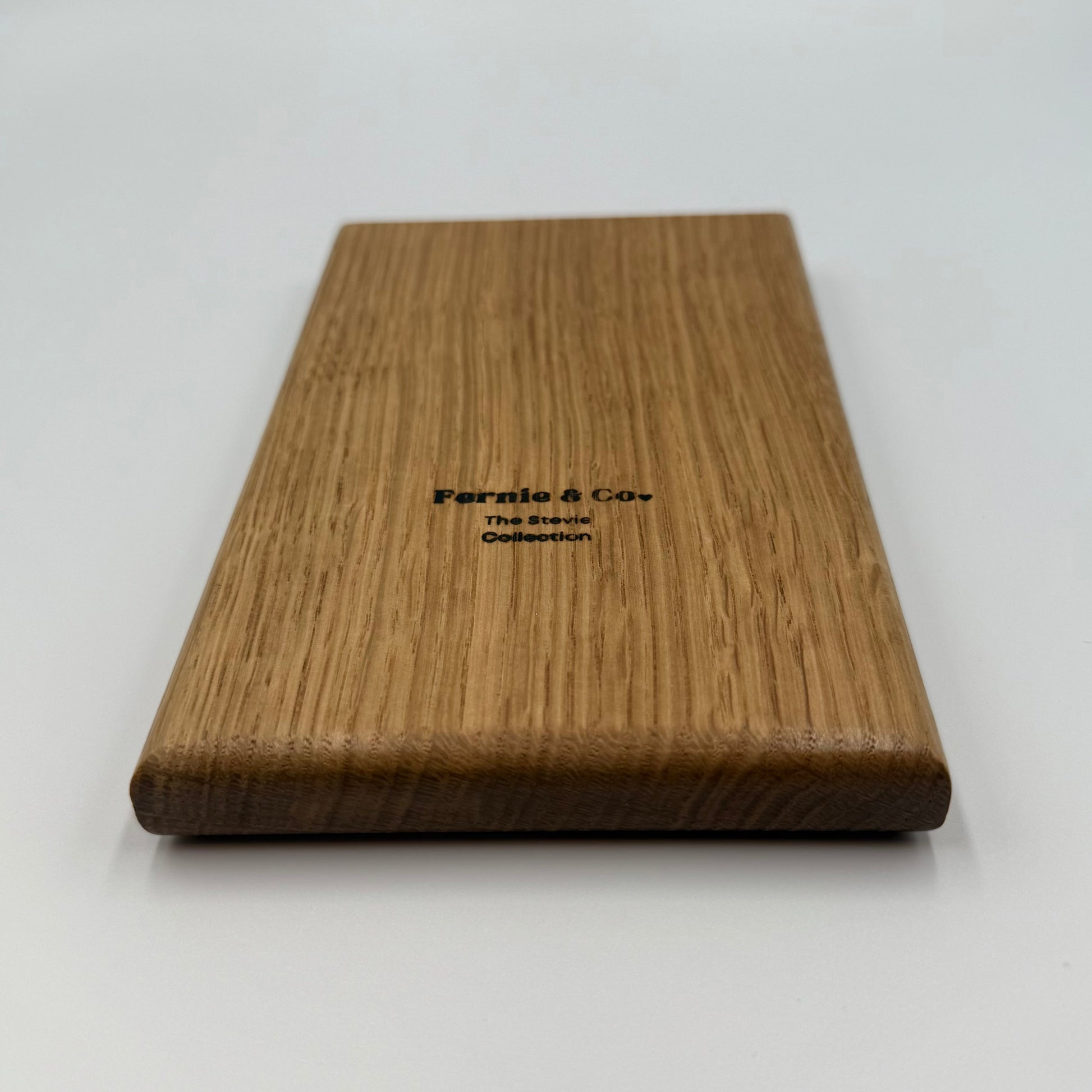 back of white oak tic tac toe board game with Fernie and Co. logo.