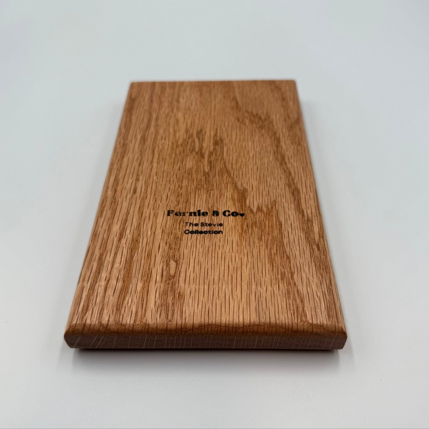 Back of red oak tic tac toe board with Fernie and Co. logo.