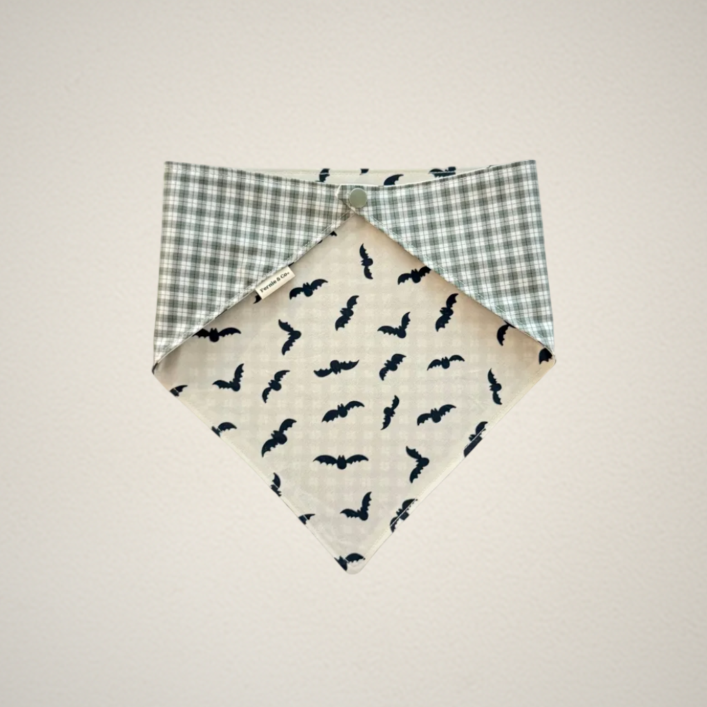 pet bandana with white fabric and bats and green and white plaid fabric.