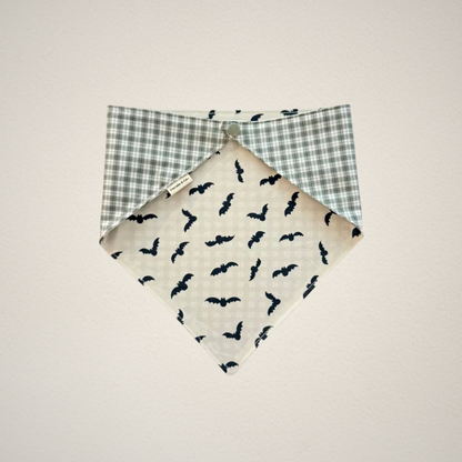 pet bandana with white fabric and bats and green and white plaid fabric.