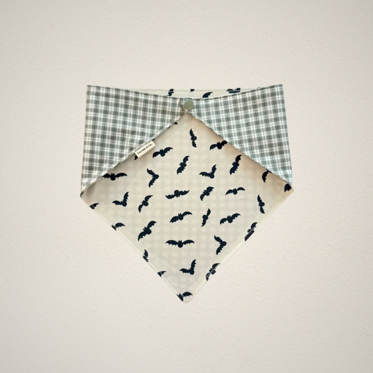 pet bandana with white fabric and bats and green and white plaid fabric.