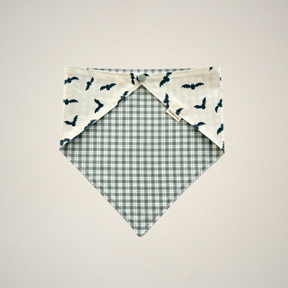 pet bandana with white fabric and bats and green and white plaid fabric.