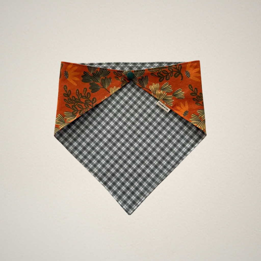 pet bandana with orange floral pattern and green and white plaid fabric