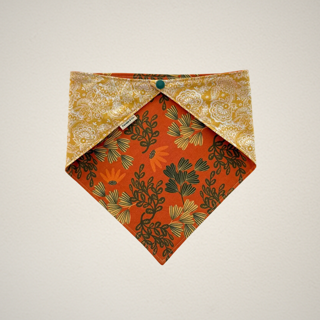 pet bandana with orange floral fabric and yellow paisley fabric.