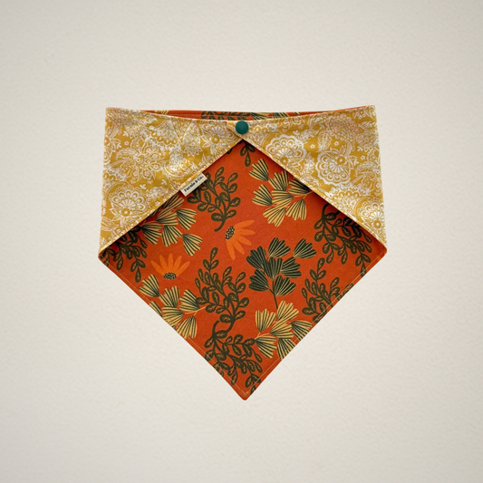pet bandana with orange floral fabric and yellow paisley fabric.