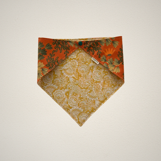 pet bandana with orange floral fabric and yellow paisley fabric.