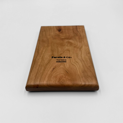 The back of a solid cherry wood tic tac toe game board with a Fernie and Co. logo.