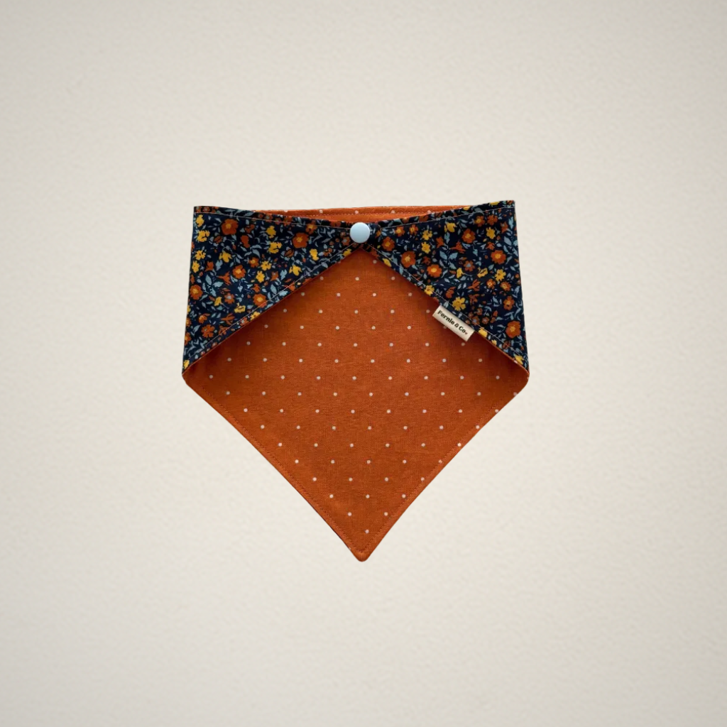 pet bandana with blue floral patter and orange dots