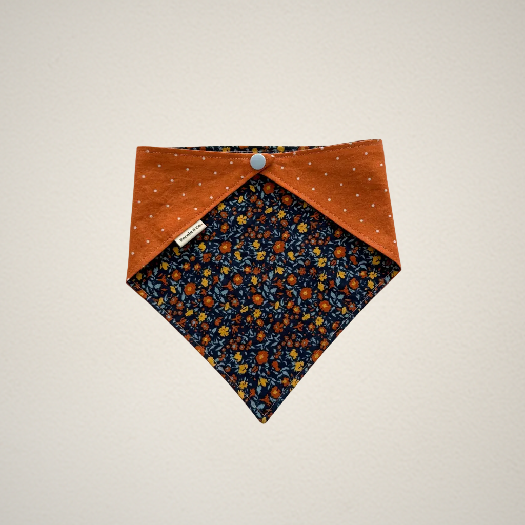 pet bandana with blue floral patter and orange dots