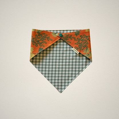 pet bandana with orange floral fabric paired with a green and white plaid fabric