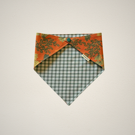 pet bandana with orange floral fabric paired with a green and white plaid fabric