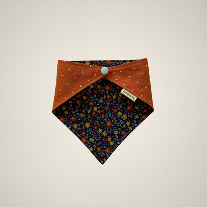 pet bandana with multicolor floral fabric and orange fabric with white dots