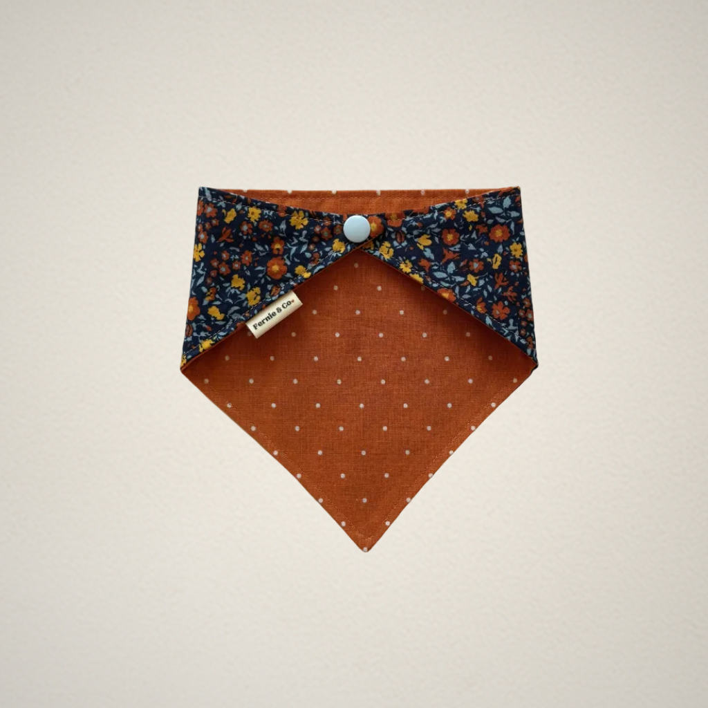 pet bandana with multicolor floral fabric and orange fabric with white dots