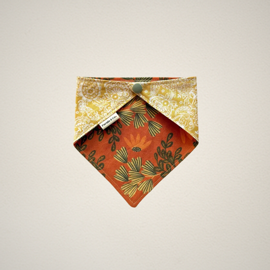 pet bandana with orange floral fabric and yellow and white paisley fabric