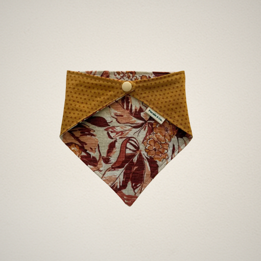 pet bandana with red and orange floral fabric and rust color dotted fabric
