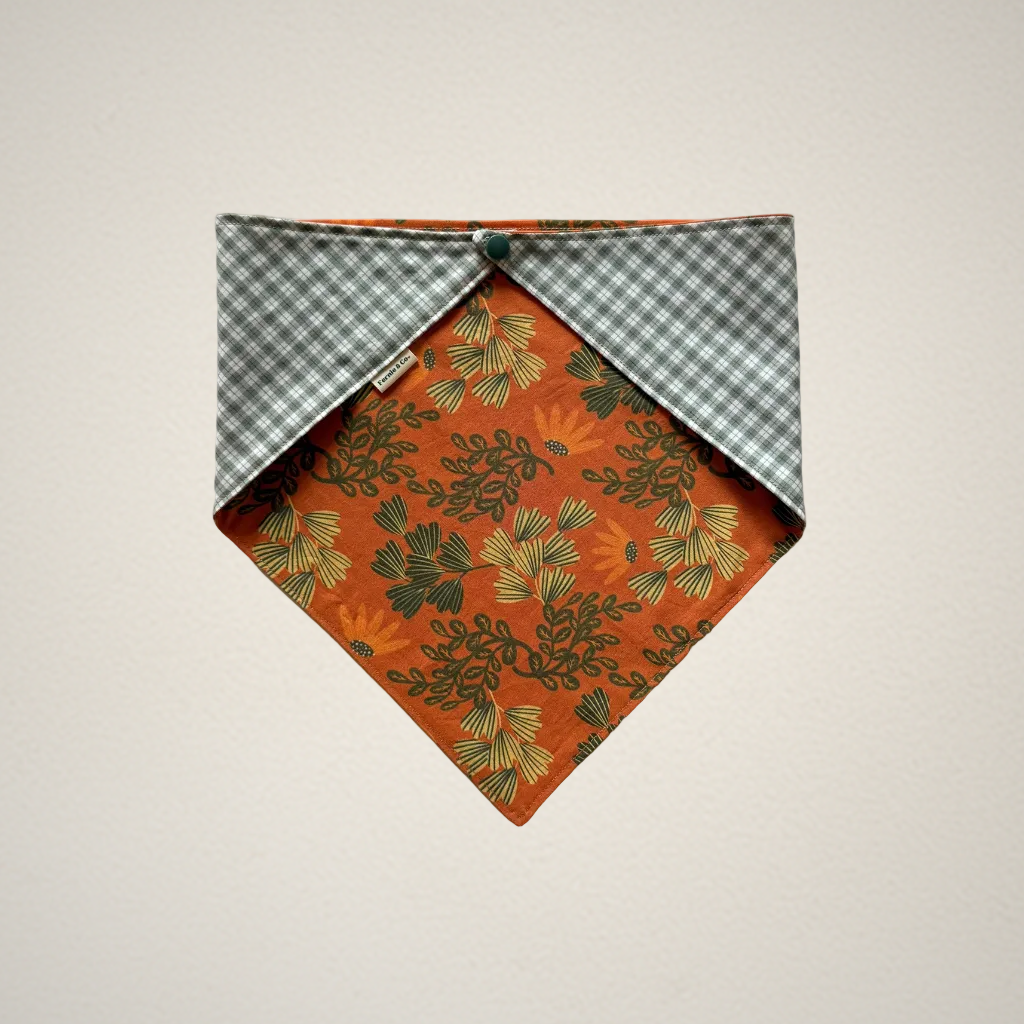 pet bandana with orange floral fabric and green and white plaid fabric
