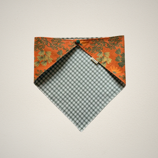 pet bandana with orange floral fabric and green and white plaid fabric