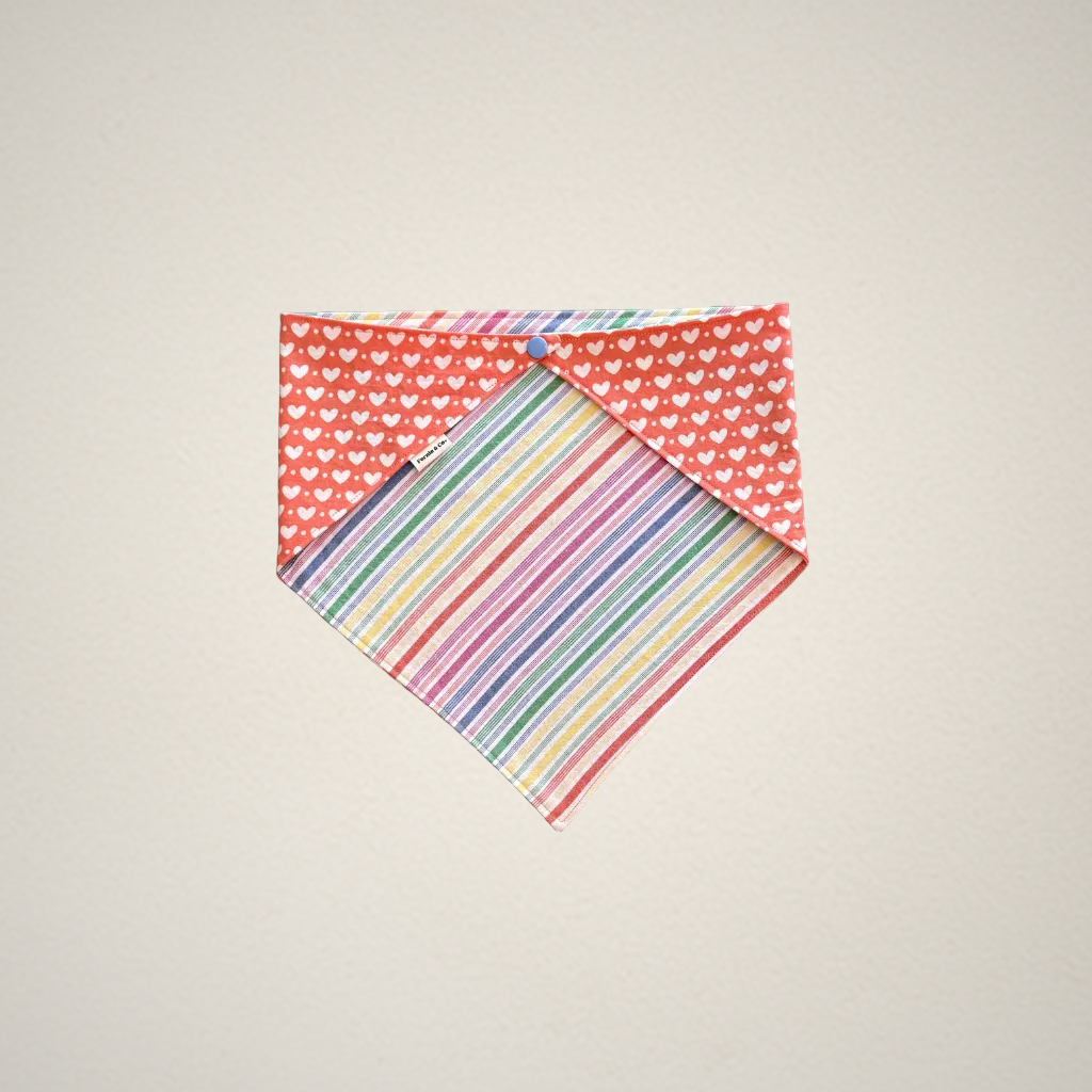Extra Large pet bandana with heart pattern on one side and striped pattern on the other, on a beige background.