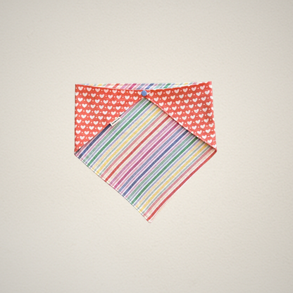 Extra Large pet bandana with heart pattern on one side and striped pattern on the other, on a beige background.