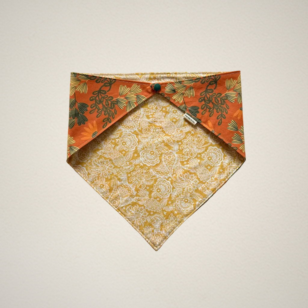 pet bandana with orange floral fabric and yellow and white paisley fabric